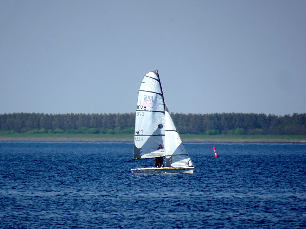 Boat on the Grevelingenmeer lake, viewed from the northwest side of the Grevelingendam