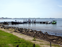 People catching crabs on a pier at the northwest side of the Grevelingendam