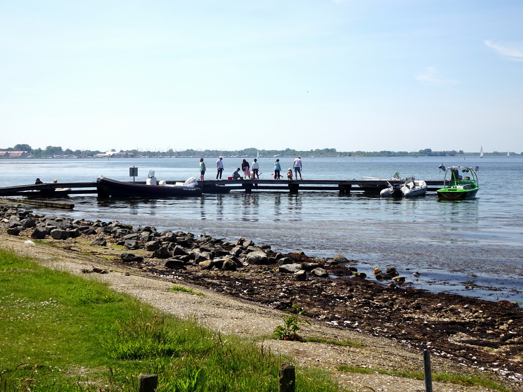 People catching crabs on a pier at the northwest side of the Grevelingendam