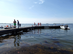 People catching crabs on a pier at the northwest side of the Grevelingendam