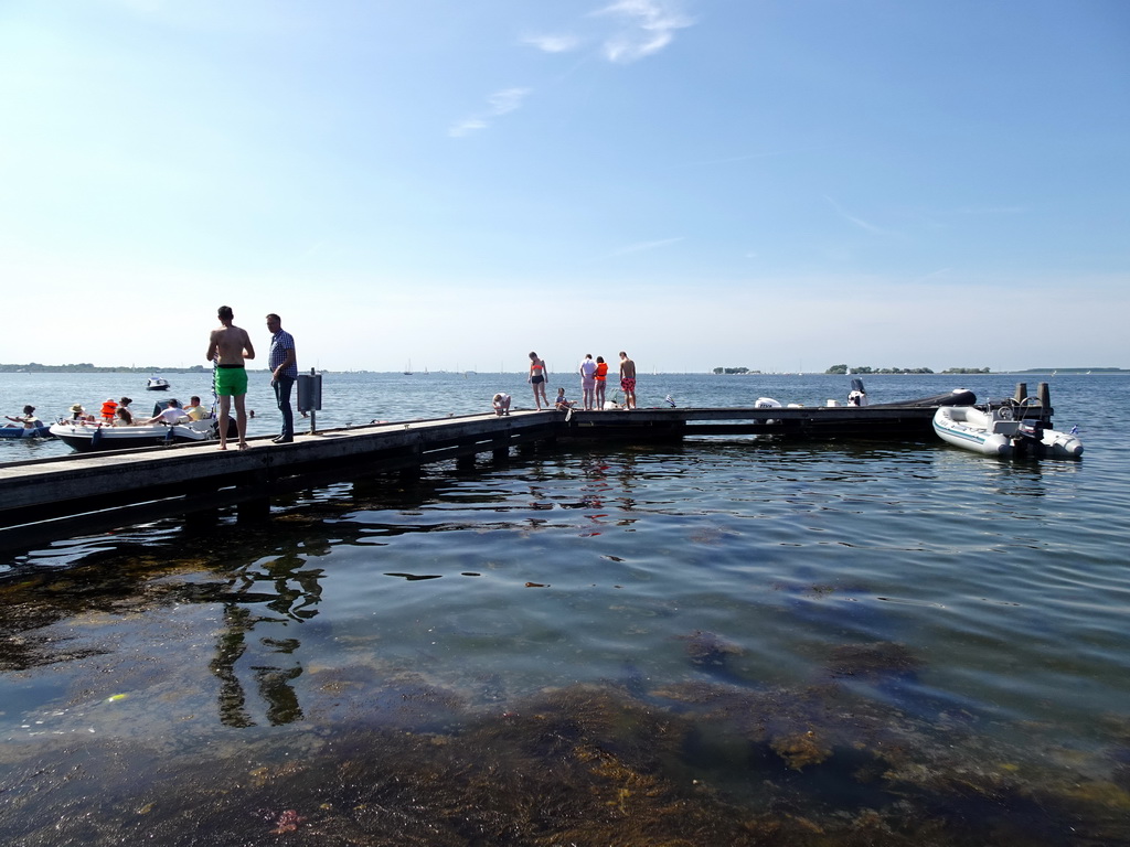 People catching crabs on a pier at the northwest side of the Grevelingendam