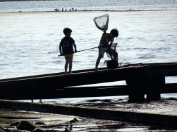 Our friends catching crabs on a pier at the northwest side of the Grevelingendam