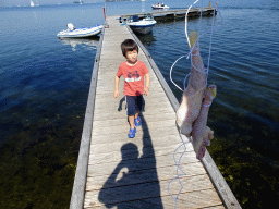 Max with chicken legs on a pier at the northwest side of the Grevelingendam