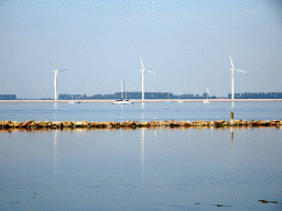 Windmills and boats in the Grevelingenmeer lake, viewed from the north side of the Grevelingendam