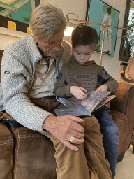 Max and his grandfather with Pokémon cards at his grandfather`s home