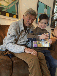 Max and his grandfather with Pokémon cards at his grandfather`s home