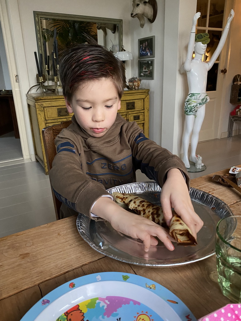 Max eating pancakes at his grandfather`s home