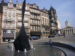 Fountain at the Mont des Arts hill and the Place Royale square with the equestrian statue of Godfrey of Bouillon and the Église Saint-Jacques-sur-Coudenberg church