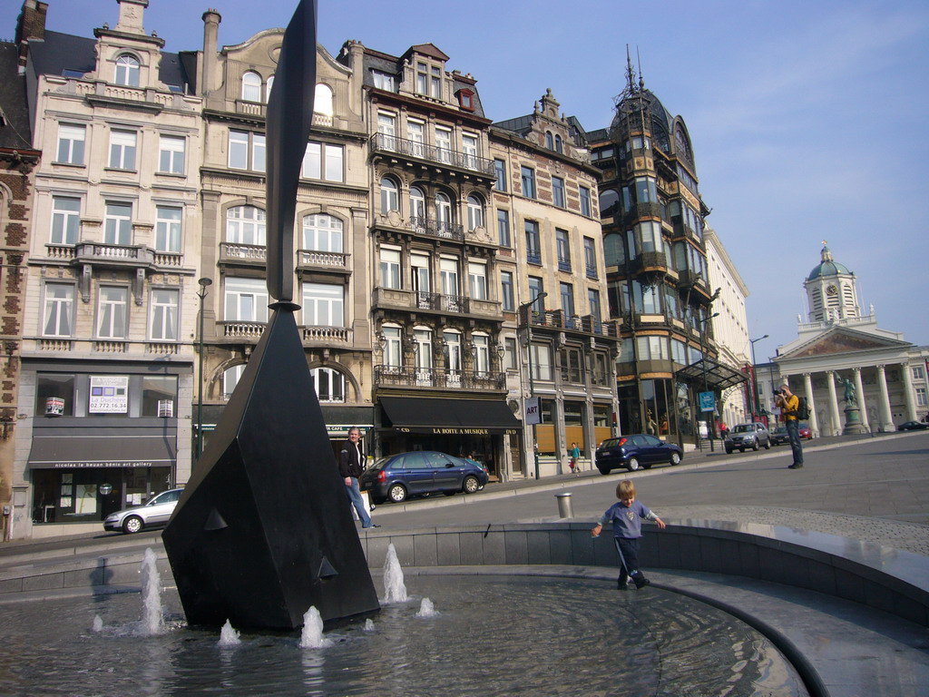 Fountain at the Mont des Arts hill and the Place Royale square with the equestrian statue of Godfrey of Bouillon and the Église Saint-Jacques-sur-Coudenberg church