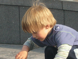 Child playing in a fountain at the Mont des Arts hill