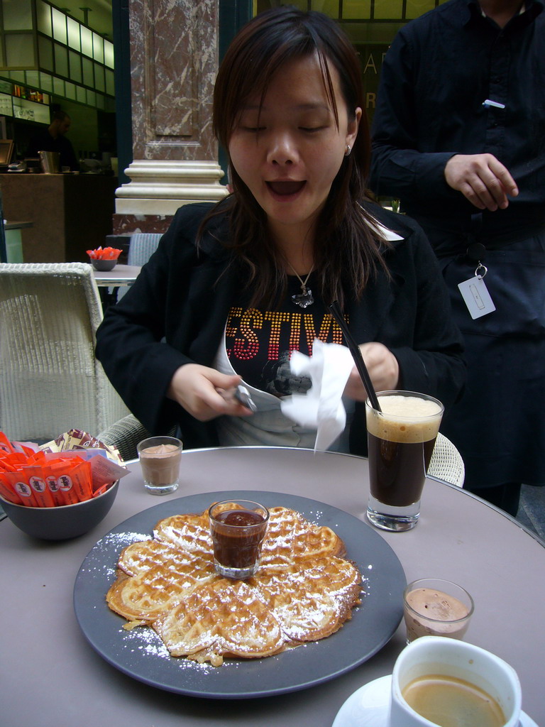Miaomiao having waffles and coffee at the Café du Vaudeville at the Galeries Royales Saint-Hubert