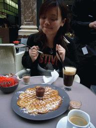 Miaomiao having waffles and coffee at the Café du Vaudeville at the Galeries Royales Saint-Hubert