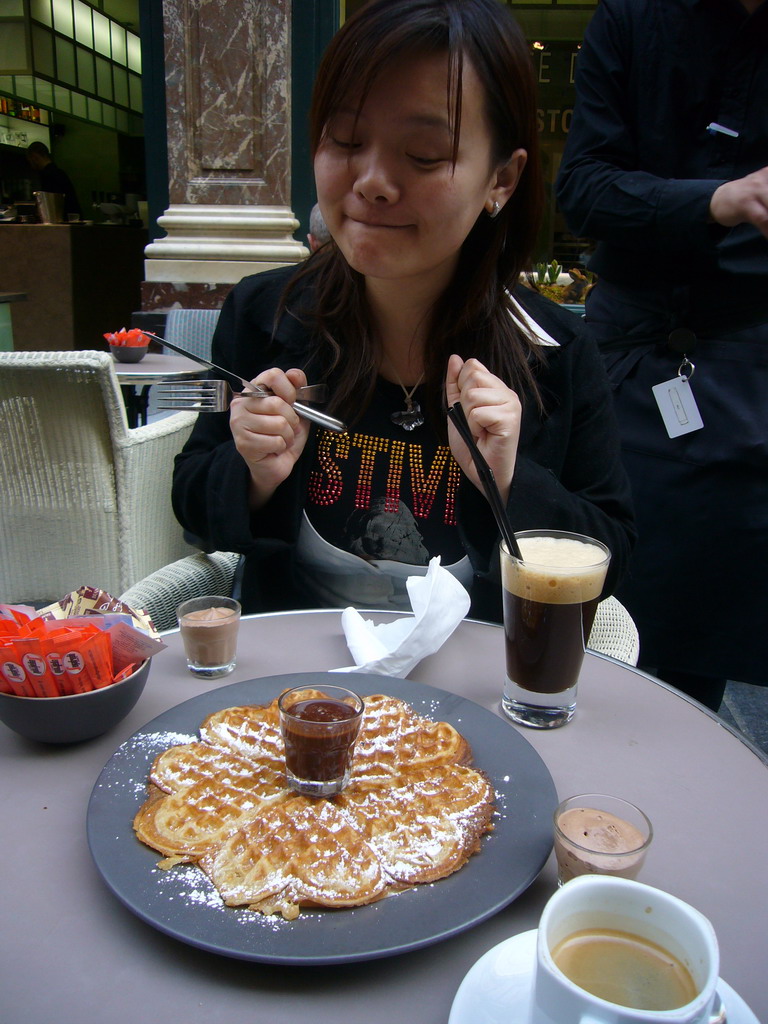 Miaomiao having waffles and coffee at the Café du Vaudeville at the Galeries Royales Saint-Hubert