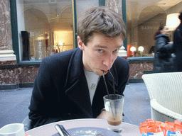 Tim having waffles and coffee at the Café du Vaudeville at the Galeries Royales Saint-Hubert