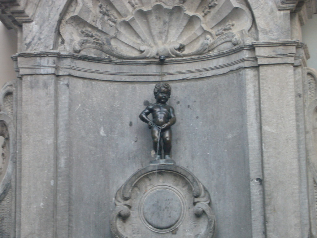 Fountain `Manneken Pis` at the crossing of the Rue de l`Étuve street and the Rue du Chêne street