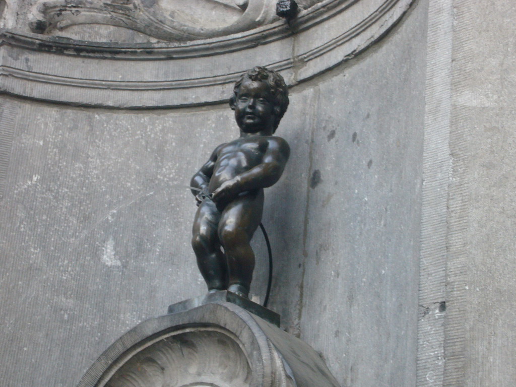 Fountain `Manneken Pis` at the crossing of the Rue de l`Étuve street and the Rue du Chêne street