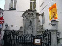 Fountain `Manneken Pis` at the crossing of the Rue de l`Étuve street and the Rue du Chêne street