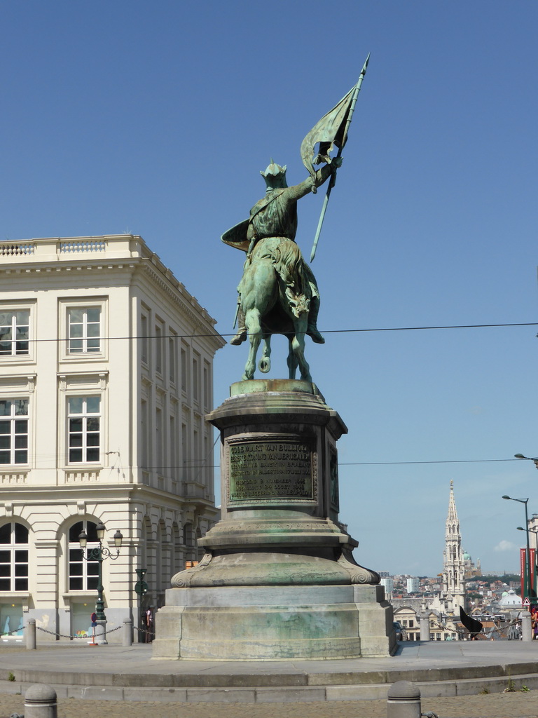 The equestrian statue of Godfrey of Bouillon at the Place Royale square, the tower of the City Hall and the Basilique du Sacré-Coeur de Bruxelles church