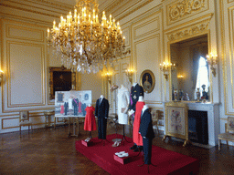 Photograph and clothing from the coronation of King Philippe, in the Small White Drawing Room of the Royal Palace of Brussels