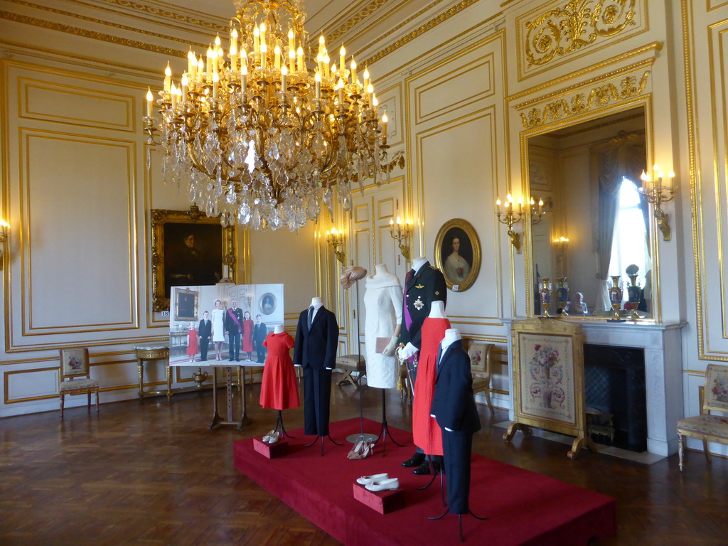 Photograph and clothing from the coronation of King Philippe, in the Small White Drawing Room of the Royal Palace of Brussels