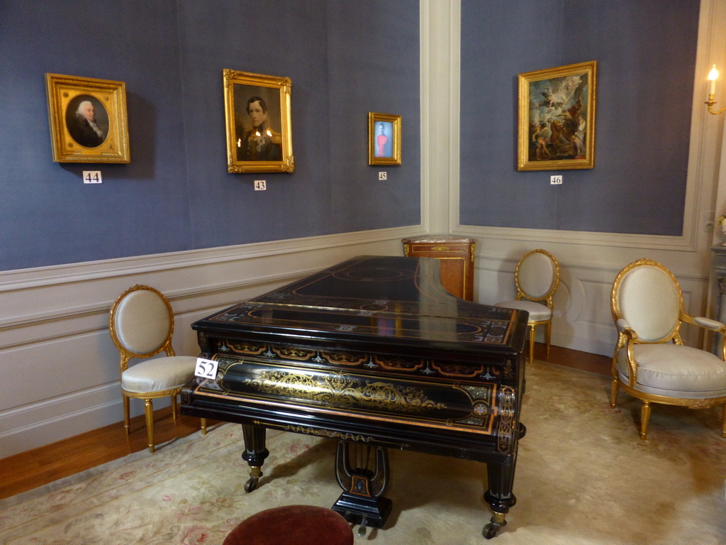 Piano and paintings in the Louis XVI Room of the Royal Palace of Brussels