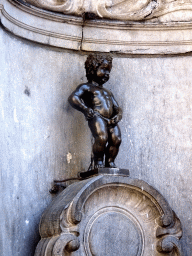 Fountain `Manneken Pis` at the crossing of the Rue de l`Étuve street and the Rue du Chêne street