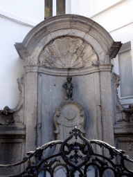 Fountain `Manneken Pis` at the crossing of the Rue de l`Étuve street and the Rue du Chêne street