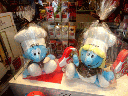 Smurf statues in the window of the Neuhaus chocolate shop at the Rue de l`Étuve street