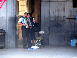 Street musician in front of the Brussels Central Station at the Carrefour de l`Europe square