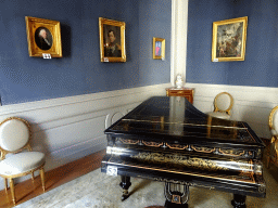 Piano and paintings in the Louis XVI Room of the Royal Palace of Brussels