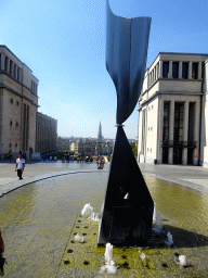 Fountain at the Mont des Arts hill, with a view on the tower of the Town Hall
