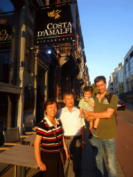 Tim, Max and Miaomiao`s parents in front of the Costa d`Amalfi restaurant at the Rue Stevin street