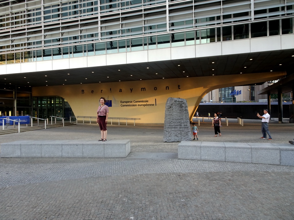 Miaomiao, Max and Miaomiao`s parents in front of the Robert Schuman Monument and the Berlaymont building of the European Commission at the Boulevard Charlemagne