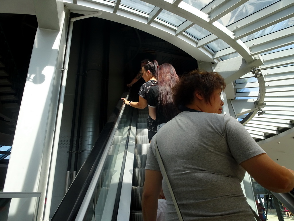 Miaomiao on the escalator from Level 0 to Level 1 of the Atomium