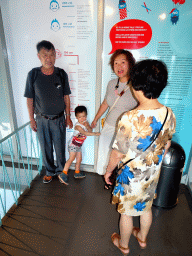 Miaomiao, Max and Miaomiao`s parents at Level 6 of the Atomium