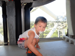 Max at Level 6 of the Atomium, with a view on the Laeken Park