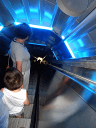 Miaomiao and Max on the escalator from Level 6 to Level 2 of the Atomium