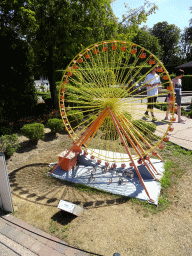 Scale model of a ferris wheel at the Walibi Belgium theme park at the Belgium section of the Mini-Europe miniature park, with explanation