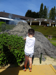 Max with a scale model of Mount Vesuvius at the Italy section of the Mini-Europe miniature park