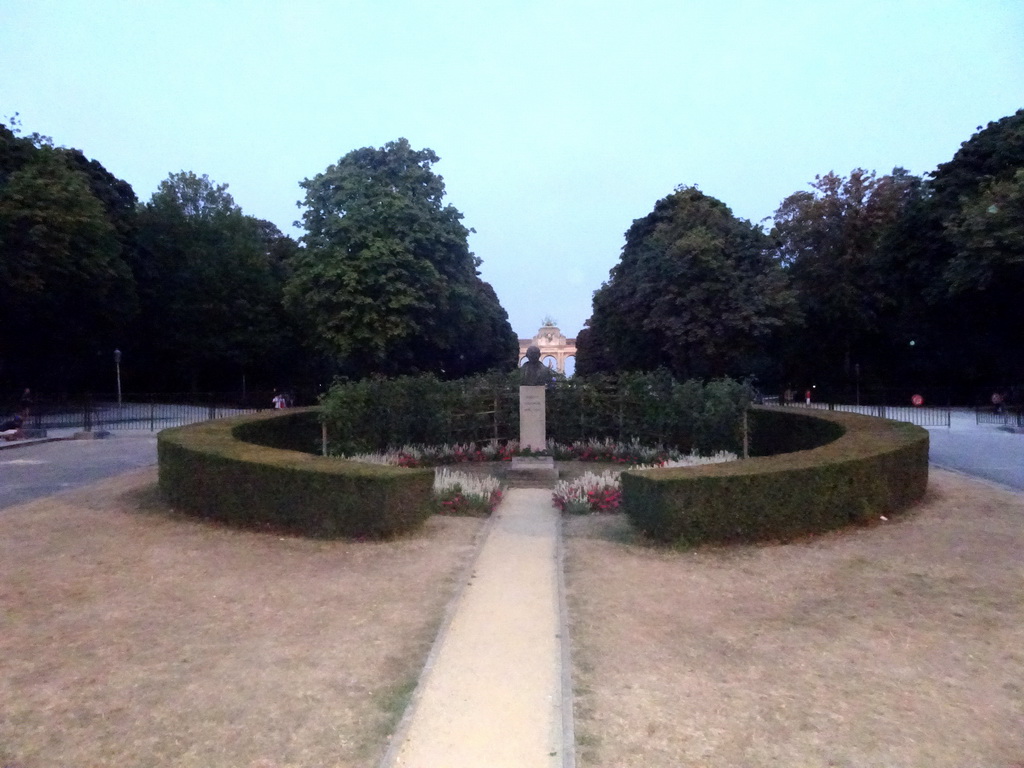 Bust of Robert Schuman and the front of the Arcade du Cinquantenaire arch at the Cinquantenaire Park, by night