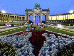 Flower bed and the front of the Arcade du Cinquantenaire arch at the Cinquantenaire Park, by night