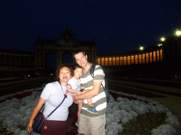 Tim, Miaomiao and Max in front of the Arcade du Cinquantenaire arch at the Cinquantenaire Park, by night