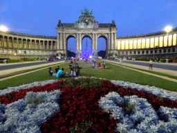 Flower bed and the front of the Arcade du Cinquantenaire arch at the Cinquantenaire Park, by night