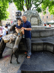 Max and Miaomiao`s father at the Charles Buls Fountain at the Place de l`Agora square