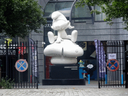 Smurf statue in front of the Smurf Store at the Rue du Marché Aux Herbes street