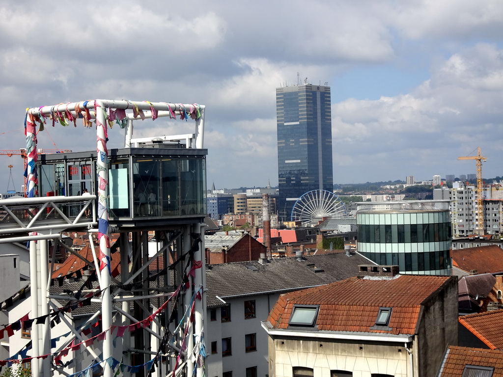 The city center with the Ascenseur des Marolles elevator, a ferris wheel and the Tour du Midi tower, viewed from the Place Poelaert square