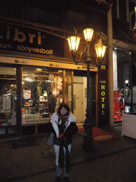 Miaomiao in front of the Promenade City Hotel in Vaci Utca street, by night