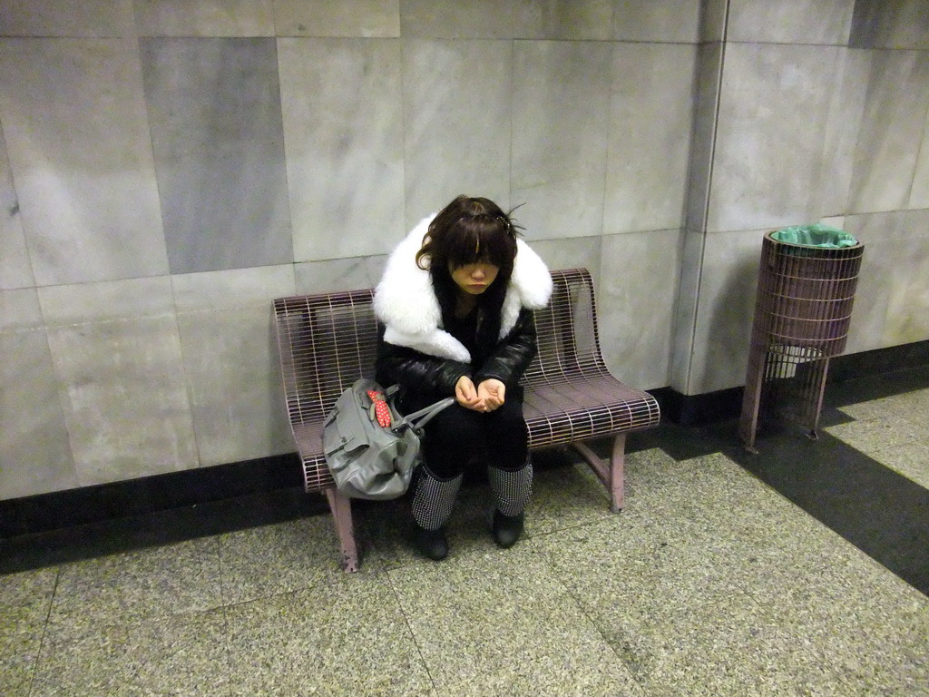 Miaomiao playing a beggar in a subway station