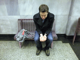 Tim playing a beggar in a subway station