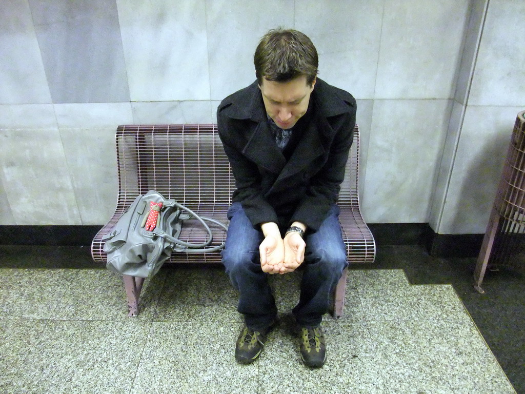 Tim playing a beggar in a subway station
